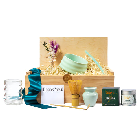 Thank You gift basket with premium matcha set including ceramic matcha bowl, whisk, and spoon, dried floral arrangement, teal ribbon, and eco-friendly packaging. Thoughtfully curated with locally sourced products from small businesses for a sustainable and plastic-free gifting experience